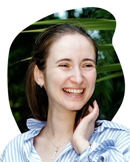 Portrait of me! Short brown hair, dark blue shirt, trees in the background.
